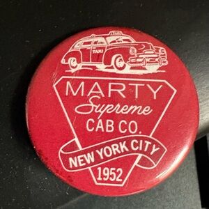 Marty Supreme Cab Co. Collectible pin, button, red
